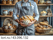 Fresh delicious bread in the hands of a male baker in close-up. Freshly baked sourdough bread with a golden crust on a wooden board. The context of a bakery with delicious bread. Confectionery products. Стоковое AI-изображение, AI-художник Photojuli / Фотобанк Лори