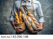Fresh delicious bread baguette in the hands of a male baker in close-up. Freshly baked sourdough bread with a golden crust. The atmosphere of a bakery with delicious bread. Confectionery products. Стоковое AI-изображение, AI-художник Photojuli / Фотобанк Лори
