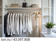 Close-up of white hangers on a white closet. The concept of order and storage in the house. Стоковое AI-изображение, AI-художник Photojuli / Фотобанк Лори