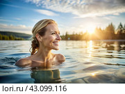 A beautiful young woman is swimming and exercising in a heated pool, a happy and smiling girl. Recreational water sports. Стоковое AI-изображение, AI-художник Photojuli / Фотобанк Лори