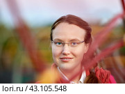 Portrait of young caucasian woman in glasses outside. Стоковое фото, фотограф Владимир Григорьев / Фотобанк Лори