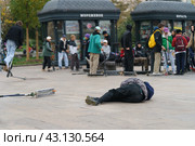 Moscow, Russia - October 2, 2021: Unsuccessful push scooter stunt on the street in autumn day. Boy did the trick. Street Jam. He fell. Extreme sports is popular among youth. He  struck one in the fall. Редакционное фото, фотограф YuryKara / Фотобанк Лори