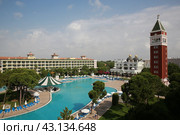 Beautiful hotel with huge swimming pool designed by Italian Venis early morning (2018 год). Редакционное фото, фотограф Константин Сергеевич Синявин / Фотобанк Лори