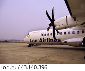 Luang Prabang / Laos - 26 Feb 2012: The airplane of Lao Airlines in Luang Prabang, Laos. Редакционное фото, фотограф Сергей Стрелков / Фотобанк Лори