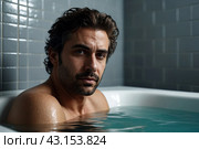 Depressed crazy man mental health in bathtub in bathroom at home looking at camera. Problem person showing human emotions. Concept apathy, anxiety, illness, trouble, creative decline. Copy space. Стоковое AI-изображение, AI-художник Aleksandr Golubev / Фотобанк Лори