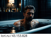 Depressed crazy man mental health in bathtub in bathroom at home looking at camera. Problem person showing human emotions. Concept apathy, anxiety, illness, trouble, creative decline. Copy space. Стоковое AI-изображение, AI-художник Aleksandr Golubev / Фотобанк Лори