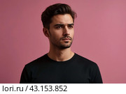 Dissatisfied young man looking unpleasantly away, expresses aversion, smirking at pink background. Guy in black t-shirt scared, negative face expressions concept. Advertising. Copy text space. Стоковое AI-изображение, AI-художник Aleksandr Golubev / Фотобанк Лори