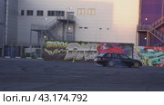 Skidding on a black retro drift car at the Mega Belaya Dacha site. The drift festival. Slow motion. Russia. Moscow. 19.05.2024. Редакционное видео, видеограф Ярославский Максим / Фотобанк Лори