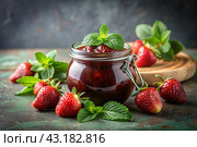 A jar of homemade strawberry, healthy jam with mint on a black background. Conservation and harvesting in summer. Стоковое AI-изображение, AI-художник Photojuli / Фотобанк Лори