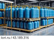 Industrial interior of warehouse storage of chemical liquids on racks and trolley. Liquid blue package storage in warehouse. Concept of industry warehousing and stored of goods. Copy ad text space. Стоковое AI-изображение, AI-художник Aleksandr Golubev / Фотобанк Лори