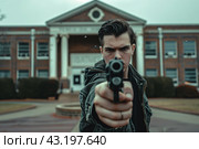 Student walking with a gun on the background of the high school, school shootings concept, school violence. Стоковое AI-изображение, AI-художник Anastacia Gaikova / Фотобанк Лори