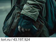 Student with a backpack walking with a gun in hand on the background of the high school, school shootings concept, school violence. Стоковое AI-изображение, AI-художник Anastacia Gaikova / Фотобанк Лори
