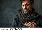 Heart attack, myocardial infarction, headache and migraine, man with head pain on a gray background, a face expressing suffering, health problems concept. Стоковое AI-изображение, AI-художник Станислав Тарко / Фотобанк Лори