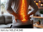 Lumbar intervertebral spine hernia, man with back pain at home, spinal disc disease. Стоковое AI-изображение, AI-художник Станислав Тарко / Фотобанк Лори