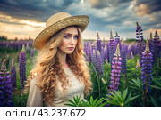 Spring flowering. Portrait of a beautiful curly-haired girl in a straw hat in a blooming field of lupines. The girl poses and looks at the camera. Стоковое AI-изображение, AI-художник Photojuli / Фотобанк Лори
