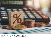 Tax season Taxation. Percent sign on wooden block, calculator, coins stack. Paperwork, financial research, report. Calculate tax return. Personal banking. Finance. Planning budget. Calculating expense. Стоковое AI-изображение, AI-художник Марина Демидюк / Фотобанк Лори