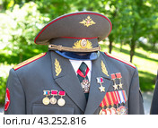 Сeremonial military uniform of Lieutenant General of the Russian Army M. Kalashnikov with various awards, orders and medals (2024 год). Редакционное фото, фотограф FotograFF / Фотобанк Лори