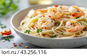 A delicious pasta dish with fresh olives and ripe tomatoes on a rustic wooden table. Стоковое AI-изображение, AI-художник Ярославский Максим / Фотобанк Лори