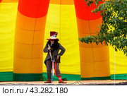 Adygea, Russia - June 1, 2018: master of ceremonies in the image Hatter from Alice in Wonderland on the scene in Adygea (admission free accreditation is not required) Редакционное фото, фотограф Андрей С / Фотобанк Лори
