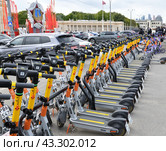 Moscow, Russia - May 9. 2024. Whoosh scooter sharing near Gorky Park. Редакционное фото, фотограф Володина Ольга / Фотобанк Лори