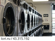 Public laundromat washers. Стоковое AI-изображение, AI-художник Ярославский Максим / Фотобанк Лори