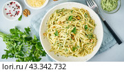 Banner with pesto pasta, bavette with walnuts, parsley, garlic, nuts, olive oil. Стоковое фото, фотограф Natalia Gdovskaia / Фотобанк Лори