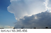 Beautiful clouds in sky. Volumetric light effect. Sunrays are hidden behind approaching dark clouds. Cumulus convection in troposphere. Cumulonimbus vertical developed. Sunset and sunrays. Стоковое видео, видеограф Юлия Петровская / Фотобанк Лори