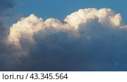 Beautiful yellow clouds in sky. Volumetric light effect. Sunrays are hidden behind approaching dark clouds. Cumulus convection in troposphere. Cumulonimbus vertical developed. Sunset and sunrays. Стоковое видео, видеограф Юлия Петровская / Фотобанк Лори