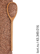 Деревянная ложка с семенами льна, выделенными на белом фоне. wooden spoon with flax seeds. Стоковое фото, фотограф Александр Собко / Фотобанк Лори