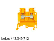 Yellow electrical terminal for connecting wires for DIN rail installation isolated on white background. Стоковое фото, фотограф Сергей Н / Фотобанк Лори
