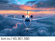 A passenger plane flies across the sky above the clouds at sunset, front view. Travel and tourism. Стоковое AI-изображение, AI-художник Коханова Наталья / Фотобанк Лори