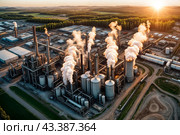 Aerial view of industrial factory with heat exchanger cracking hydrocarbons, sunset. Equipment petrochemical plant. Manufacturing industry technology concept. Gen ai illustration. Copy ad text space. Стоковое AI-изображение, AI-художник Aleksandr Golubev / Фотобанк Лори
