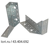 Металлический крепежный угольник на белом фоне. Metallic angle fixator on white background. Стоковое фото, фотограф Татьяна Д / Фотобанк Лори