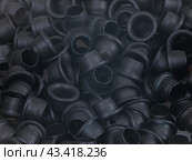Spilled black grommets isolated on white background. Стоковое фото, фотограф Елена  Попкова / Фотобанк Лори