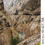 Beautiful Canyon of Moraca river in winter, Montenegro or Crna Gora, Balkan, Europe. big mountains and road with cars in north Montenegro (2022 год). Редакционное фото, фотограф Павел Муравьев / Фотобанк Лори