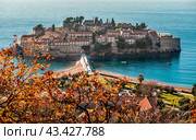 Sveti Stefan is a small islet and 5-star hotel resort on Adriatic coast of Montenegro near of Budva. Resort is known commercially as Aman Sveti Stefan and includes part of the mainland (2022 год). Стоковое фото, фотограф Павел Муравьев / Фотобанк Лори