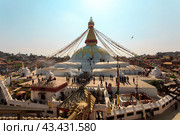 Kathmandu, Nepal - November 17, 2018: People walk around Boudhanath stupa in Kathmandu, Nepal. View from above. Редакционное фото, фотограф VittoriaChe / Фотобанк Лори