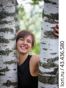 Beautiful woman with an emotional expression on the background of birches, embodying harmony with nature. Стоковое фото, фотограф Юрий Поздников / Фотобанк Лори