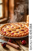 A cherry pie is set on a wooden table, wafting smoke, creating an appetizing scene. Стоковое AI-изображение, AI-художник Юрий Поздников / Фотобанк Лори