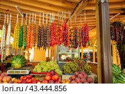 Local food market with Chuckhole traditional georgian homemade sweets with nuts and grape juice. Стоковое фото, фотограф Дмитрий Львович Алферов / Фотобанк Лори