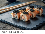 Japanese food. Sushi rolls California, Philadelphia with eel, red caviar and salmon. The concept of the sushi bar menu. Стоковое AI-изображение, AI-художник Photojuli / Фотобанк Лори