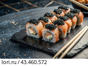 Japanese food. Sushi rolls California, Philadelphia with eel, red caviar and salmon. The concept of the sushi bar menu. Стоковое AI-изображение, AI-художник Photojuli / Фотобанк Лори