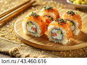 Japanese food. Sushi rolls California, Philadelphia with eel, red caviar and salmon. The concept of the sushi bar menu. Стоковое AI-изображение, AI-художник Photojuli / Фотобанк Лори