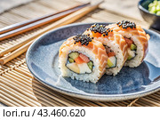 Japanese food. Sushi rolls California, Philadelphia with eel, red caviar and salmon. The concept of the sushi bar menu. Стоковое AI-изображение, AI-художник Photojuli / Фотобанк Лори