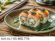 Japanese food. Sushi rolls California, Philadelphia with eel, red caviar and salmon. The concept of the sushi bar menu. Стоковое фото, фотограф Photojuli / Фотобанк Лори