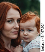 A mother lovingly gazes at her infant baby, holding the child close in her arms. Cute infant child is calm. Love of mother and child. Happy childhood. Family relationships, motherhood and fertility. Стоковое AI-изображение, AI-художник Юлия Петровская / Фотобанк Лори