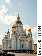 Saransk, Russia - June 5, 2023. Cathedral of St. Theodore Ushakov in Saransk, Russia. It is named after the Russian saint and admiral Fyodor Ushakov. The inscription above the entrance of the Cathedral of the Holy Righteous Warrior Theodore Ushakov. Редакционное фото, фотограф Оксана Медведева / Фотобанк Лори