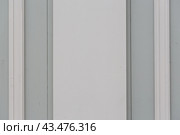 Element of a beautiful wooden wall in a classic style. White and grey vertical wooden planks. Vintage rustic texture for background and design. Стоковое фото, фотограф Андрей Степанов / Фотобанк Лори