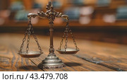 Legal office of lawyers, justice and law concept : Retro balance scale of justice on a desk in a courtroom, depicting giving fair and objective consideration to all evidence, without showing bias. Стоковое AI-видео, аниматор Ирина Михайличенко / Фотобанк Лори