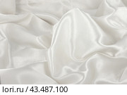 Белая атласная ткань в качестве фона.  White satin silk texture wrinkled background. Стоковое фото, фотограф Лариса Гордеева / Фотобанк Лори